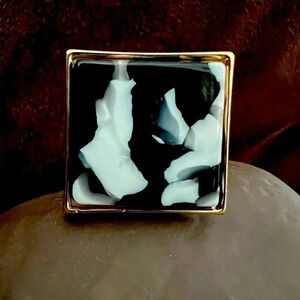 Ring- gold tone with black & white square faux stone accent. Size: 6.